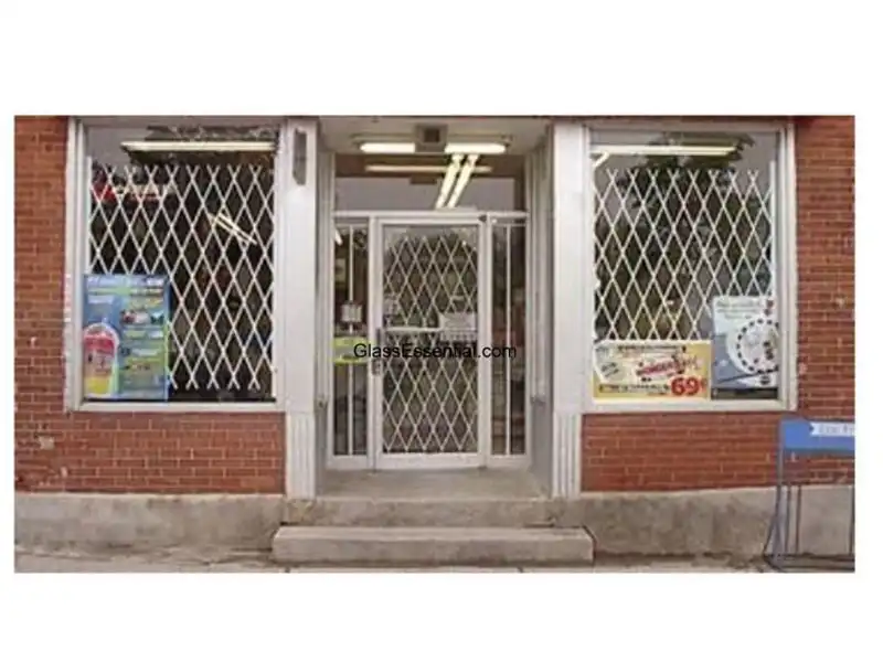 Commercial property fortified with a folding security gate