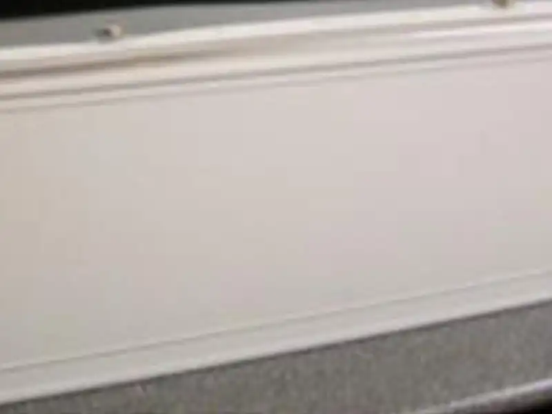 A sleek cigarette display shelf with a hinged flap for easy access